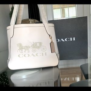 NWT Coach leather tote with carriage logo.